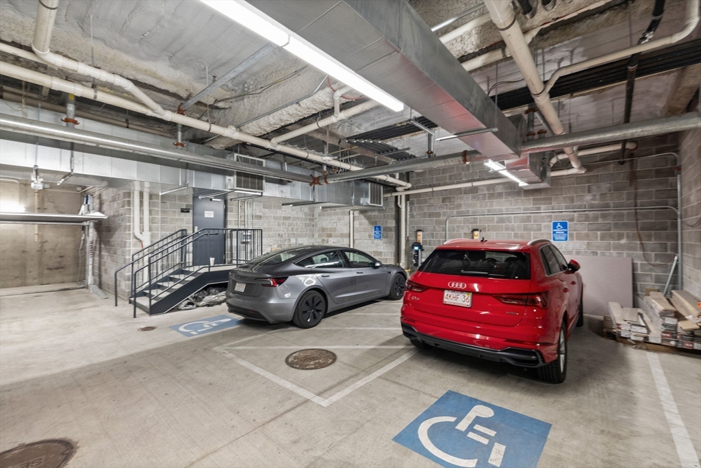 301 Border Street, Unit 409 Boston, MA 02128 - Photo 19 of 23 a view of parking garage with cars