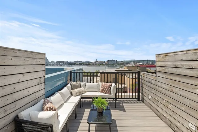 a view of a balcony with wooden floor