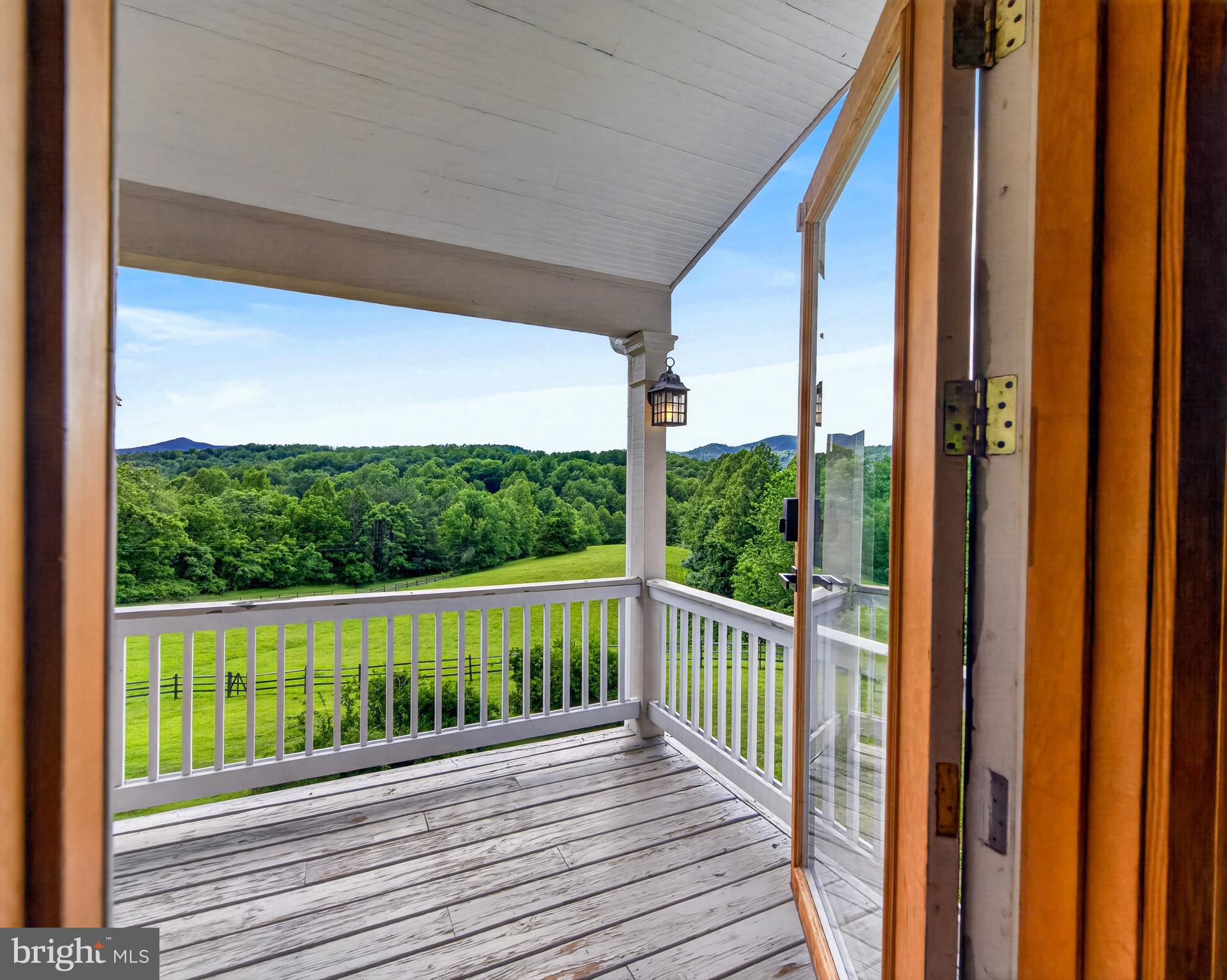 4028 South F T Valley Road Etlan, VA 22719 - Photo 63 of 101 a view of a wooden balcony with a ocean view