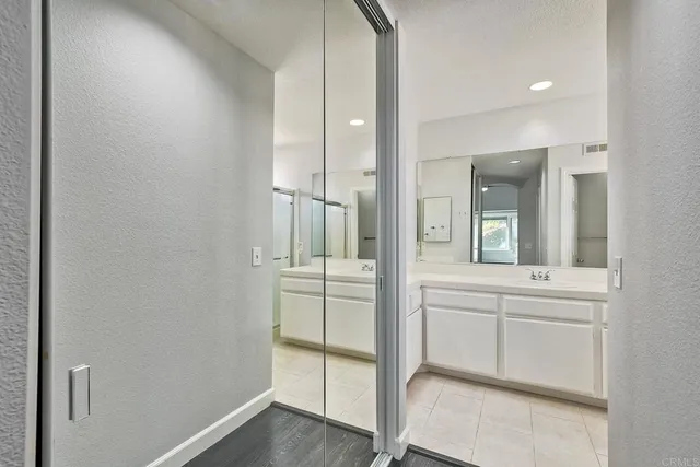 a bathroom with a shower and a sink