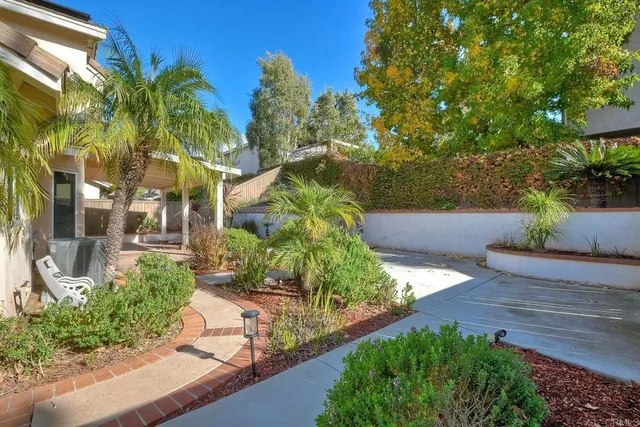 a view of a garden with a building