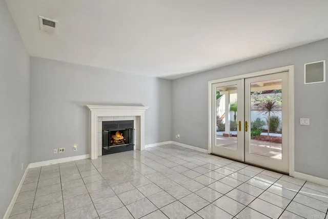 an empty room with fireplace