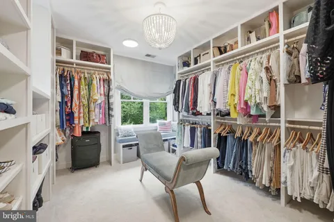 a bedroom with a bed and a cabinets