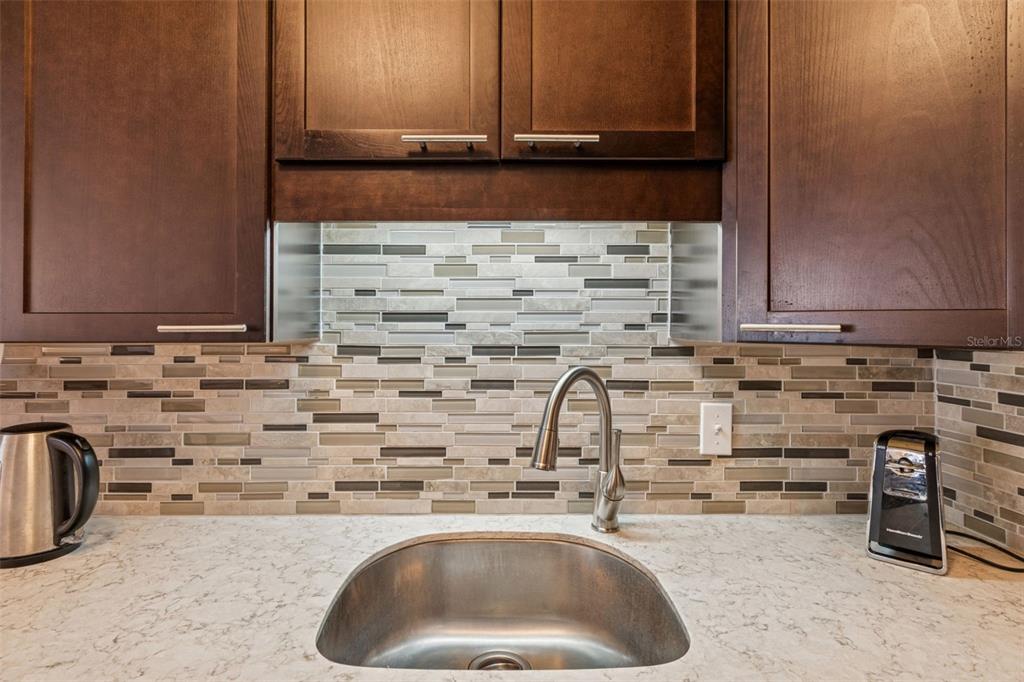 2295 Mexican Way, Unit 21 Clearwater, FL 33763 - Photo 16 of 90 a kitchen with a sink and cabinets