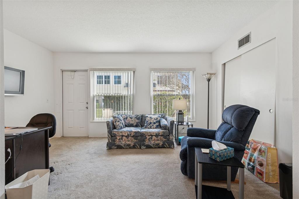2295 Mexican Way, Unit 21 Clearwater, FL 33763 - Photo 24 of 90 a living room with furniture and a window