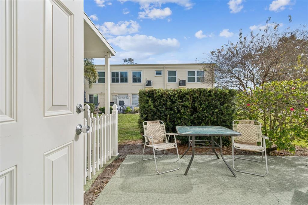 2295 Mexican Way, Unit 21 Clearwater, FL 33763 - Photo 27 of 90 a balcony with table and chairs