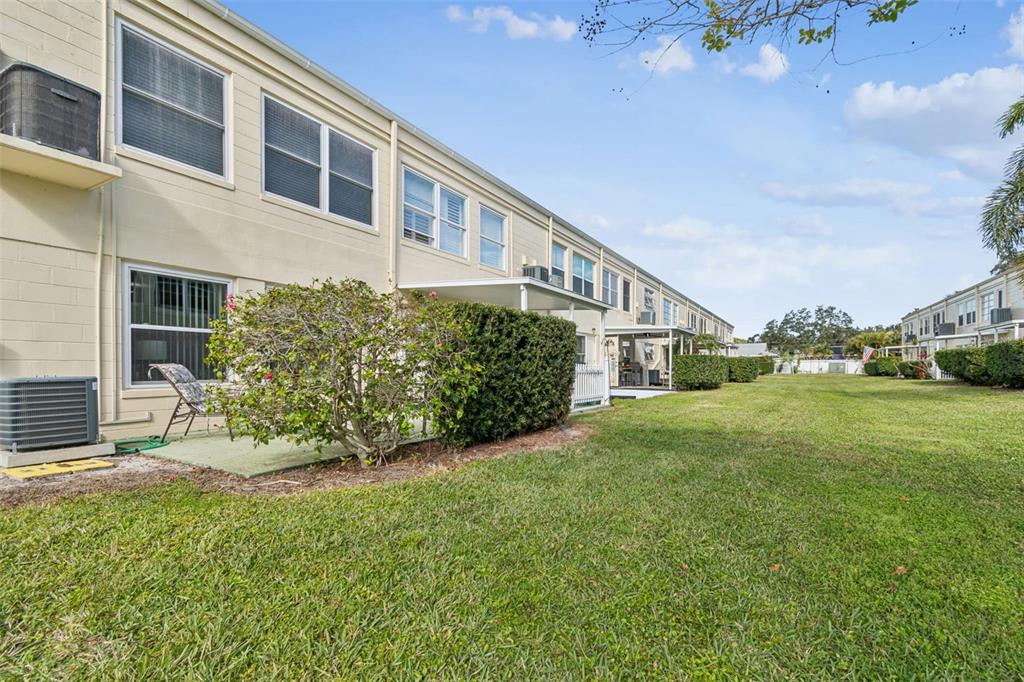 2295 Mexican Way, Unit 21 Clearwater, FL 33763 - Photo 30 of 90 a house view with a garden space