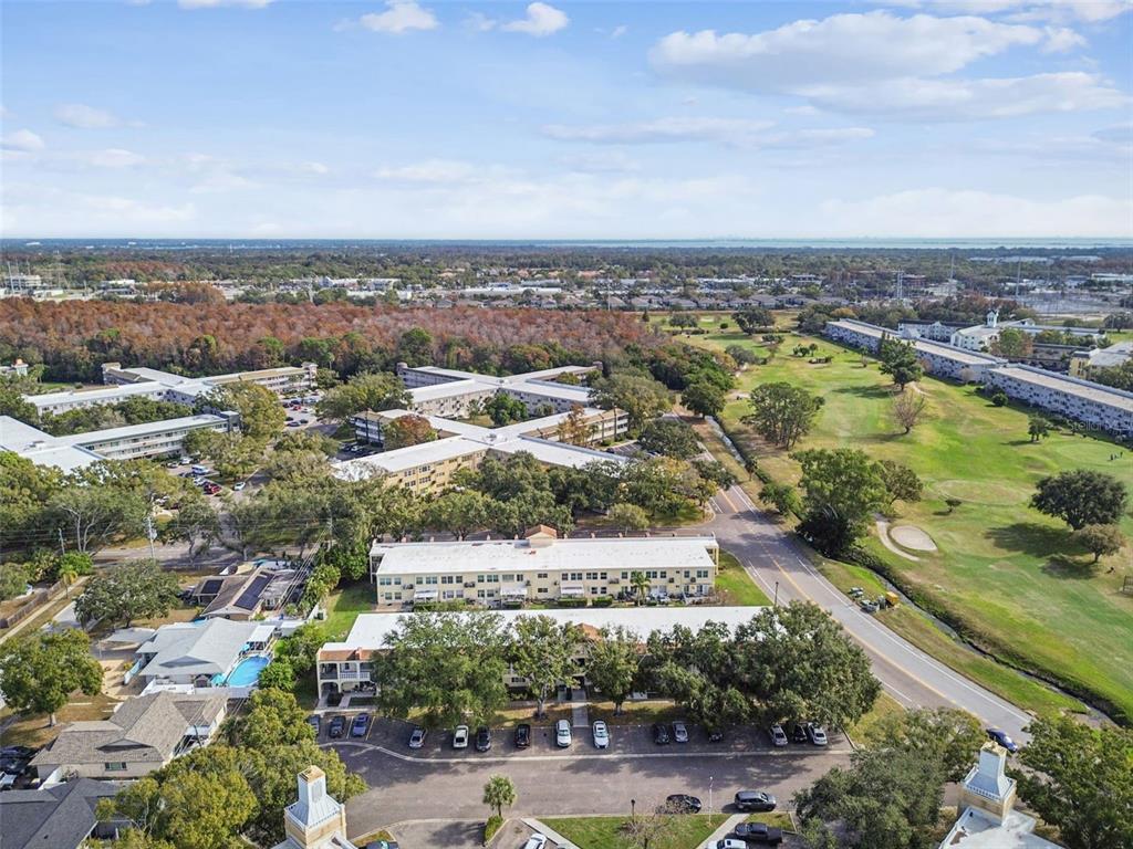 2295 Mexican Way, Unit 21 Clearwater, FL 33763 - Photo 39 of 90 an aerial view of residential building and lake view