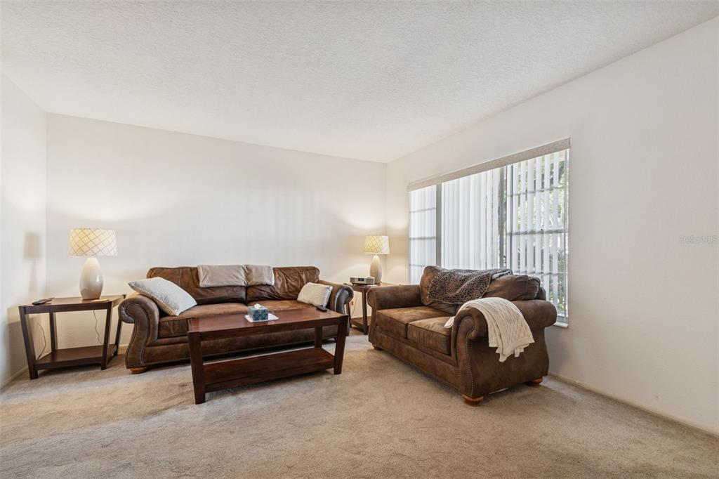 2295 Mexican Way, Unit 21 Clearwater, FL 33763 - Photo 8 of 90 a living room with furniture and a window