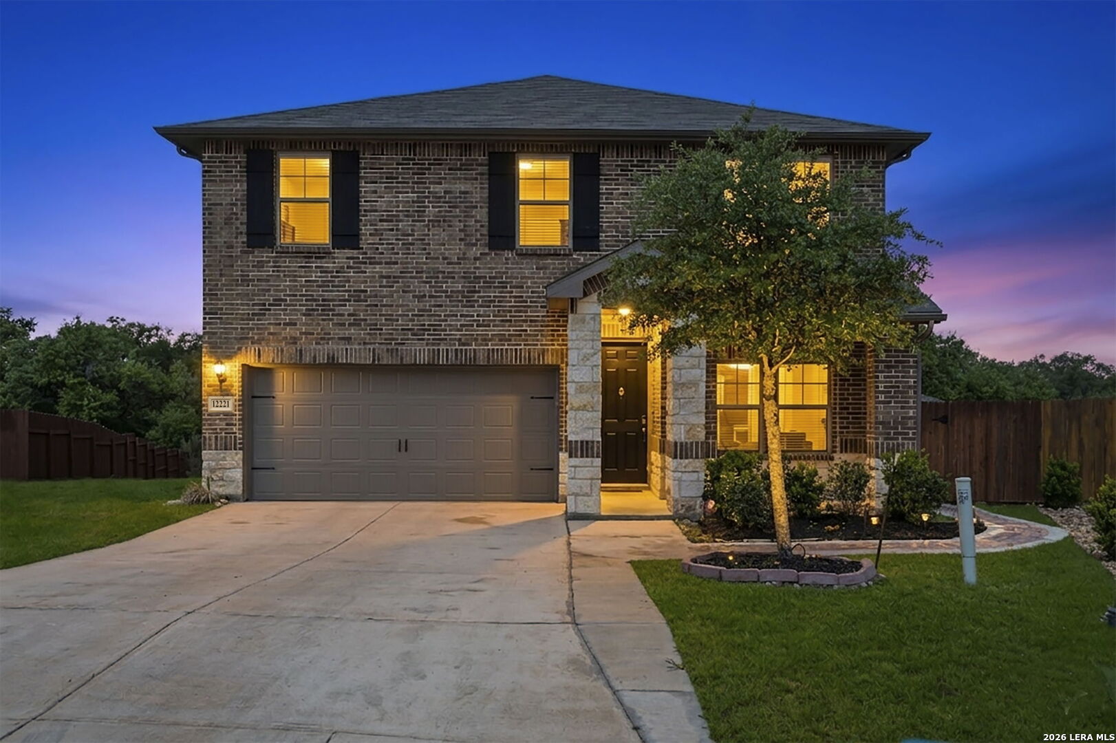 12221 Icon Ridge San Antonio, TX 78253 - Photo 1 of 46 a front view of a house with garden