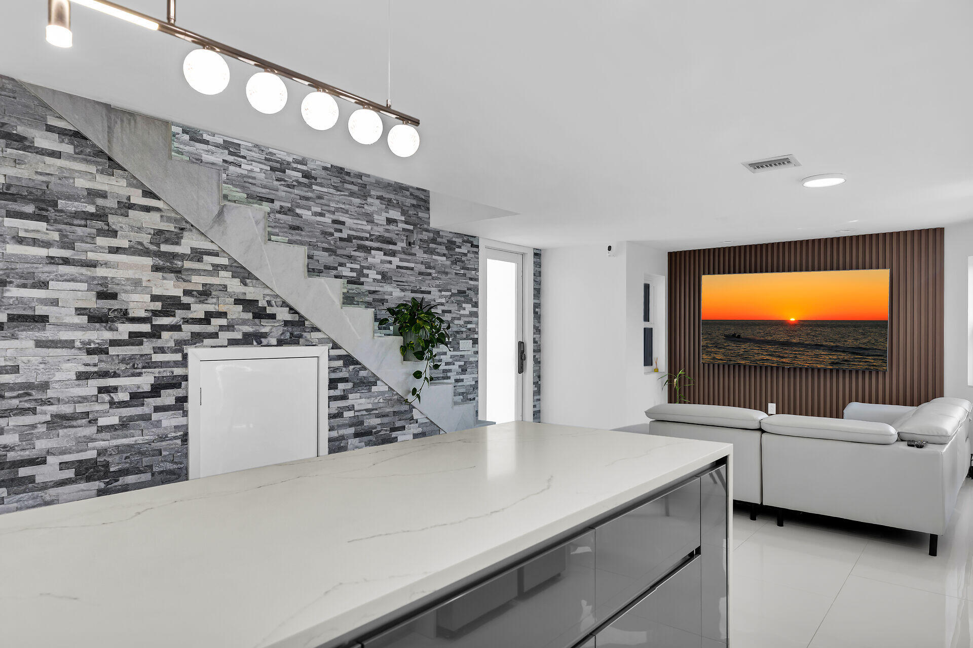209 Corsair Road Duck Key, FL 33050 - Photo 7 of 38 Stacked Stone Accent Wall and Stairwell