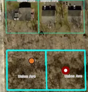 an aerial view of a residential houses with outdoor space