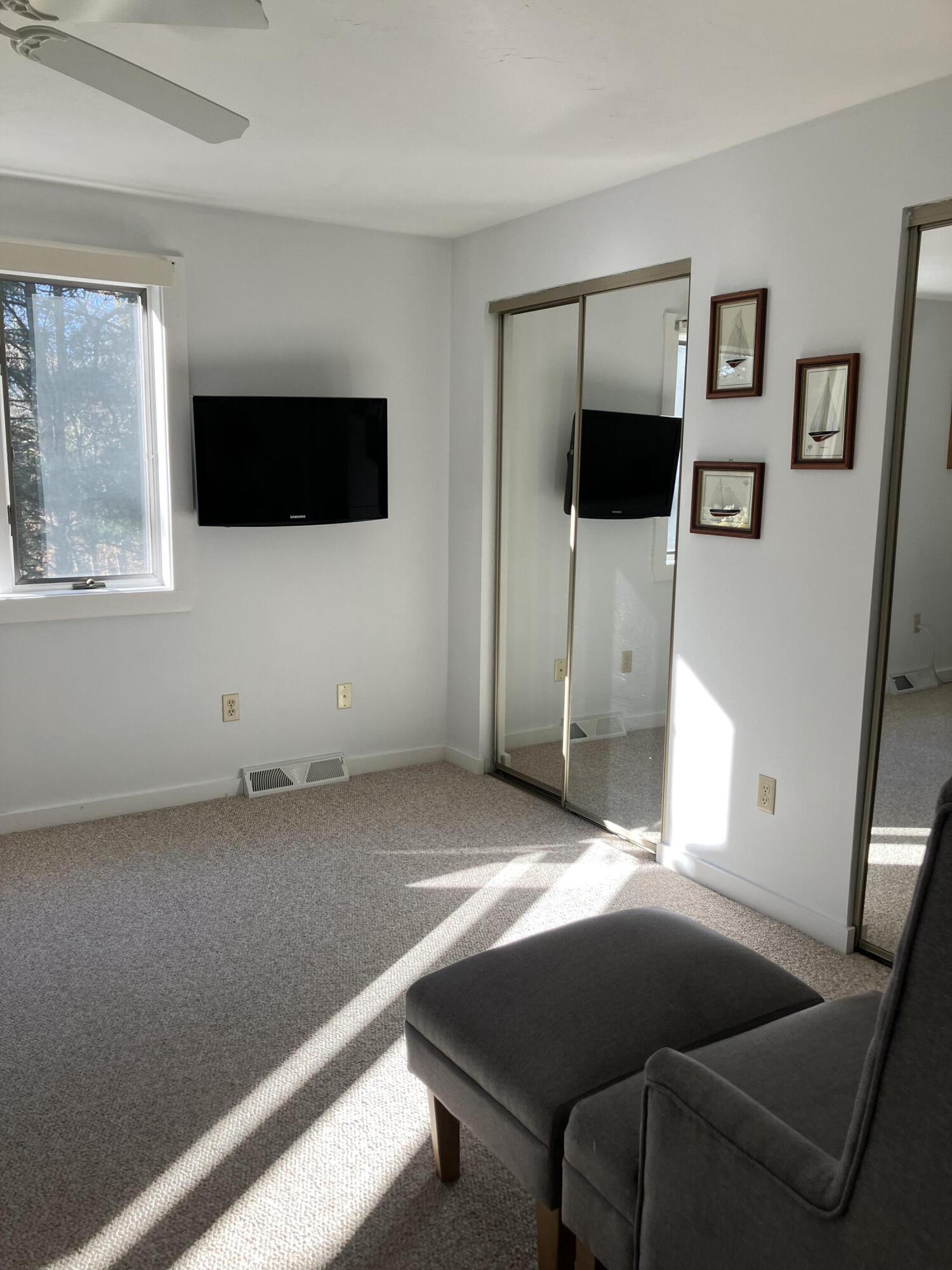 40 Shellback Way, Unit F Mashpee, MA 02649 - Photo 14 of 29 a living room with furniture and a flat screen tv