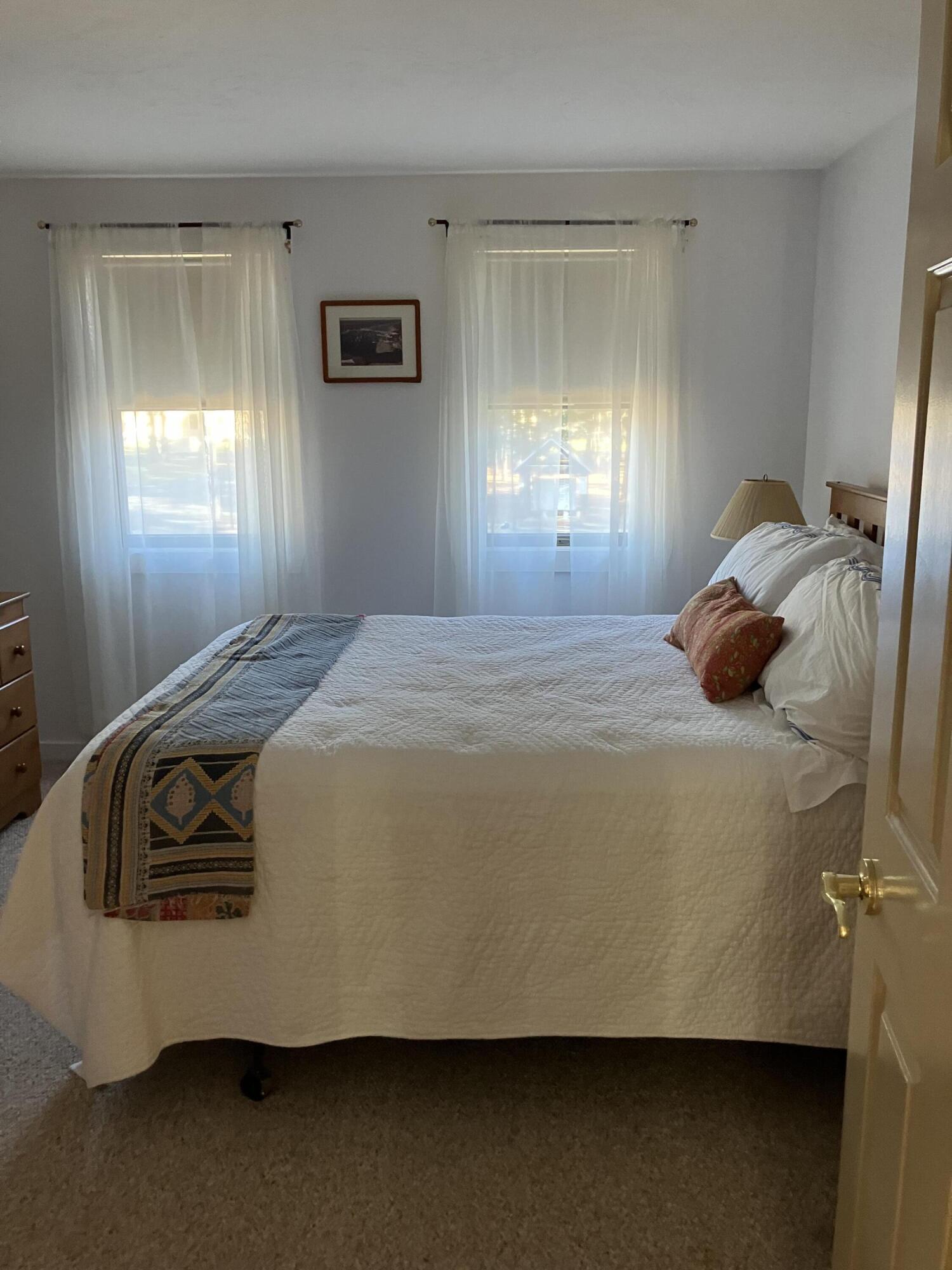 40 Shellback Way, Unit F Mashpee, MA 02649 - Photo 17 of 29 a bedroom with a bed and window