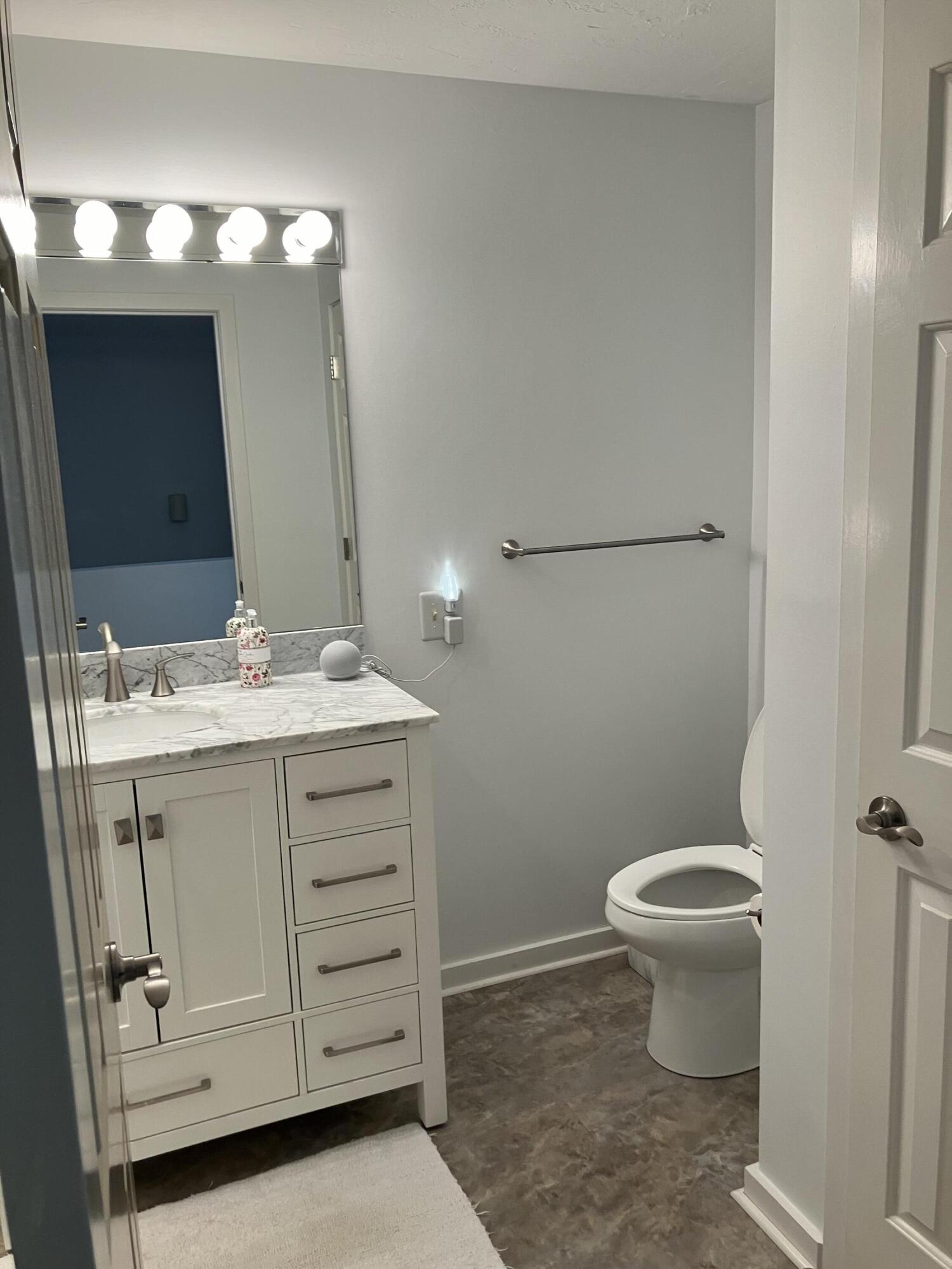 40 Shellback Way, Unit F Mashpee, MA 02649 - Photo 19 of 29 a bathroom with a sink toilet and a mirror