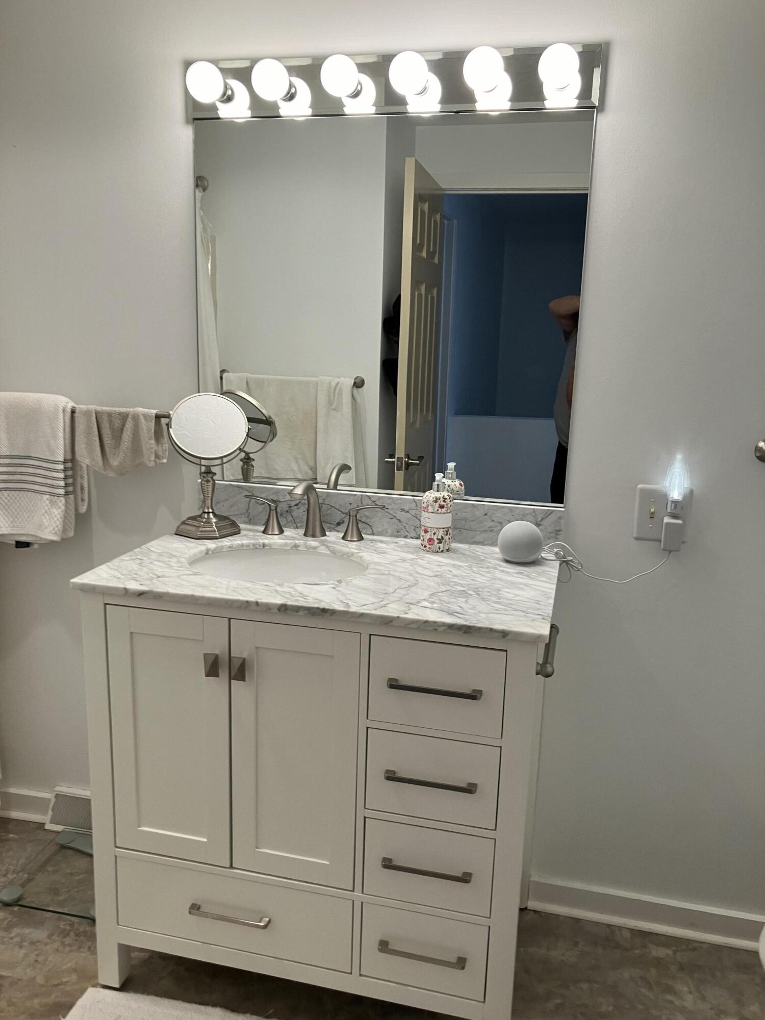 40 Shellback Way, Unit F Mashpee, MA 02649 - Photo 20 of 29 a bathroom with a sink vanity and a mirror
