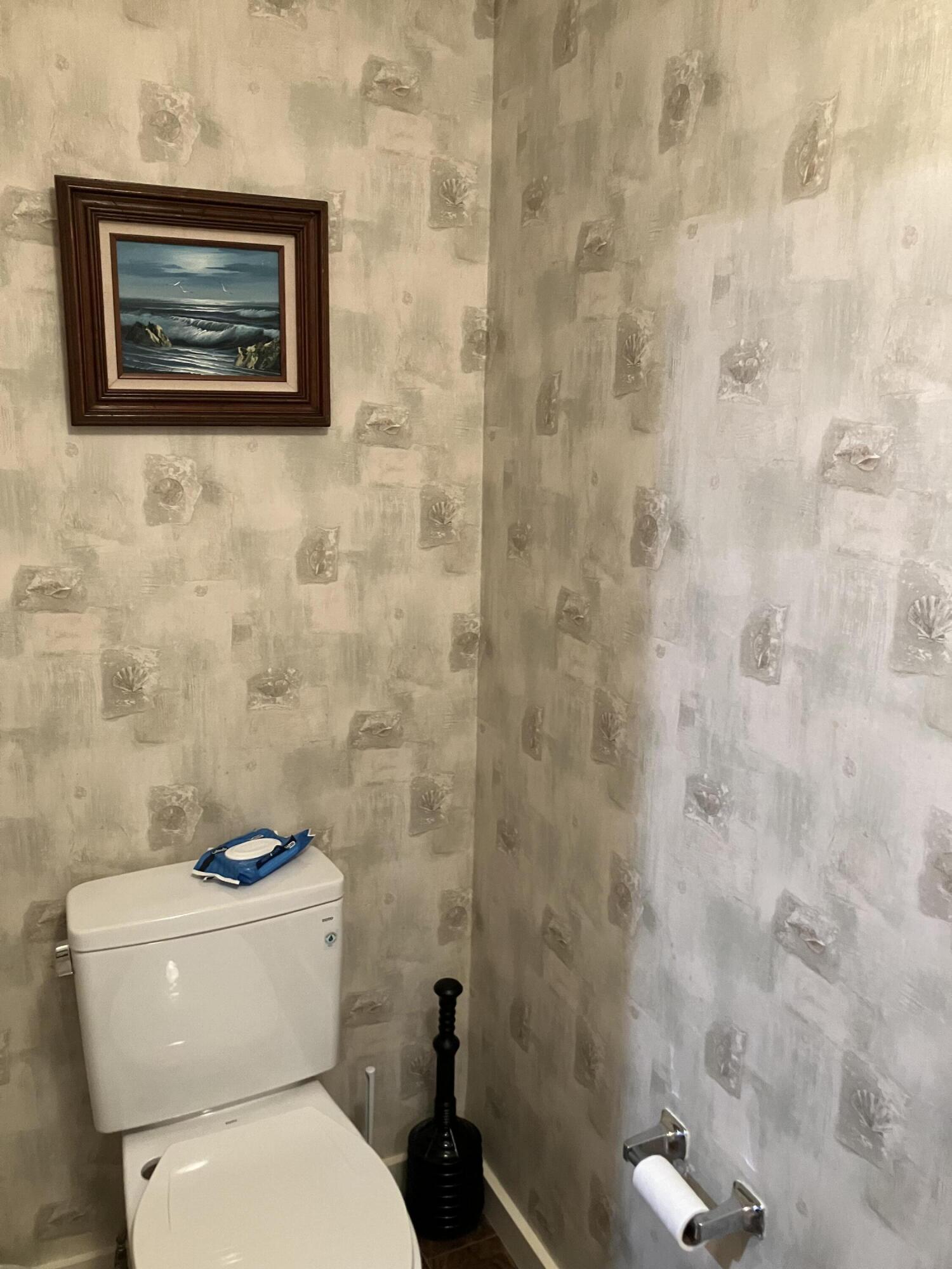 40 Shellback Way, Unit F Mashpee, MA 02649 - Photo 27 of 29 a white toilet sitting next to a white wall