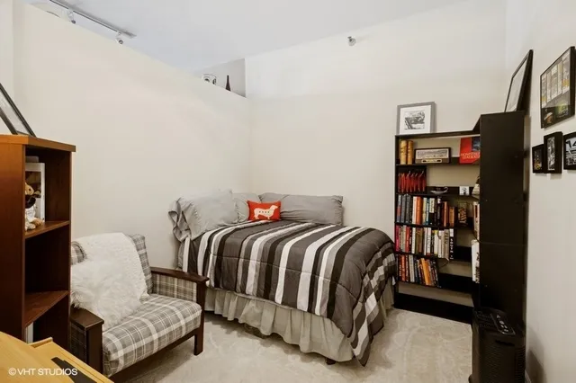 a bedroom with a bed and closet