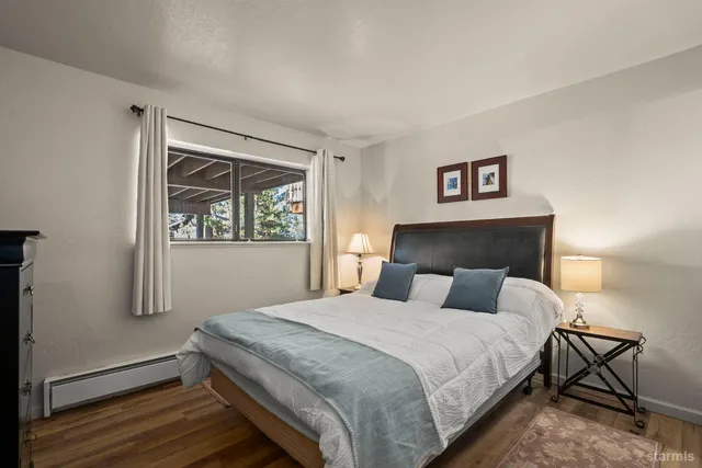 a bedroom with a bed and night stand