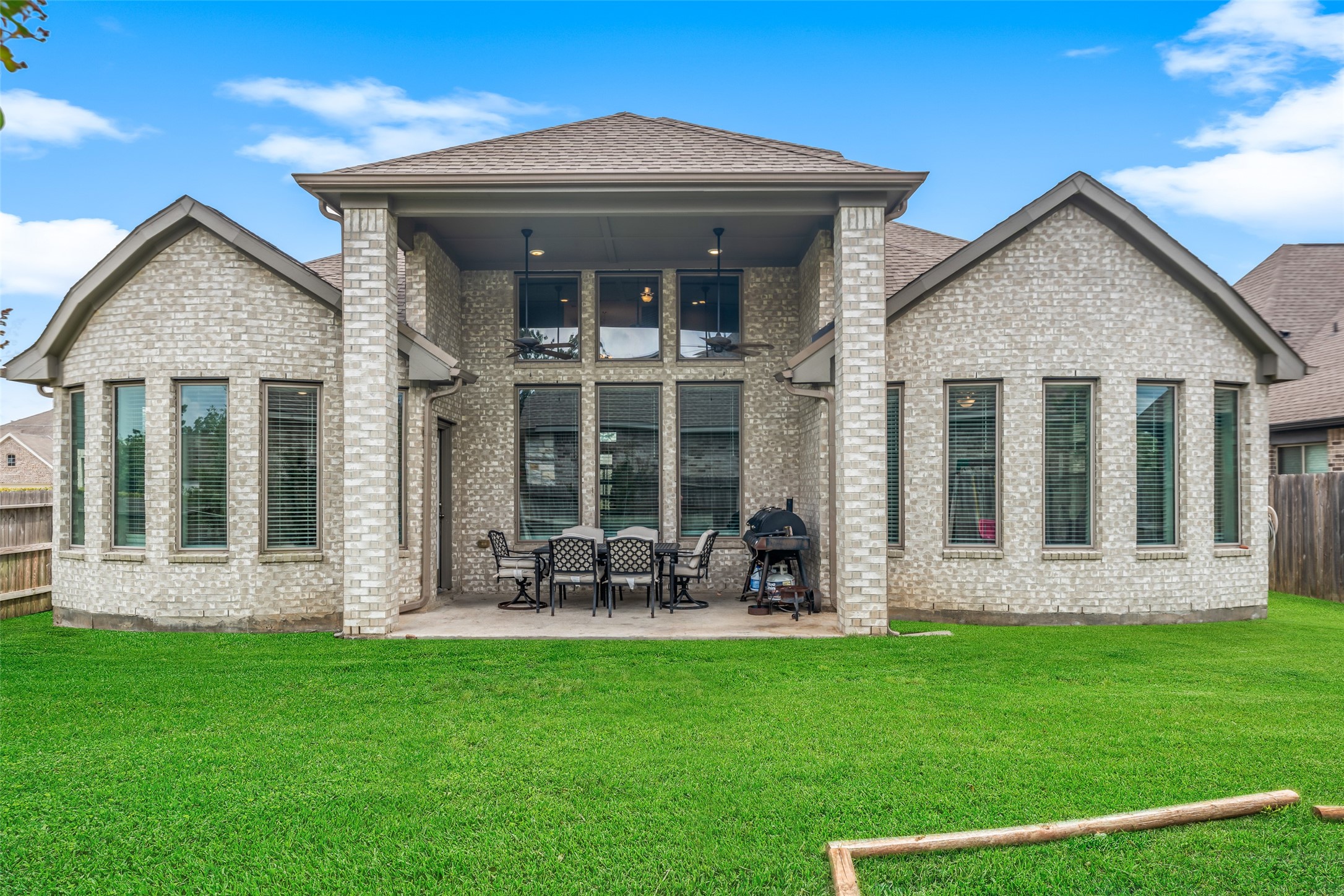 17323 Grand Canyon Road Conroe, TX 77302 - Photo 3 of 33 Extended covered patio is just one of many upgrades in this home - the double bay windows are another.