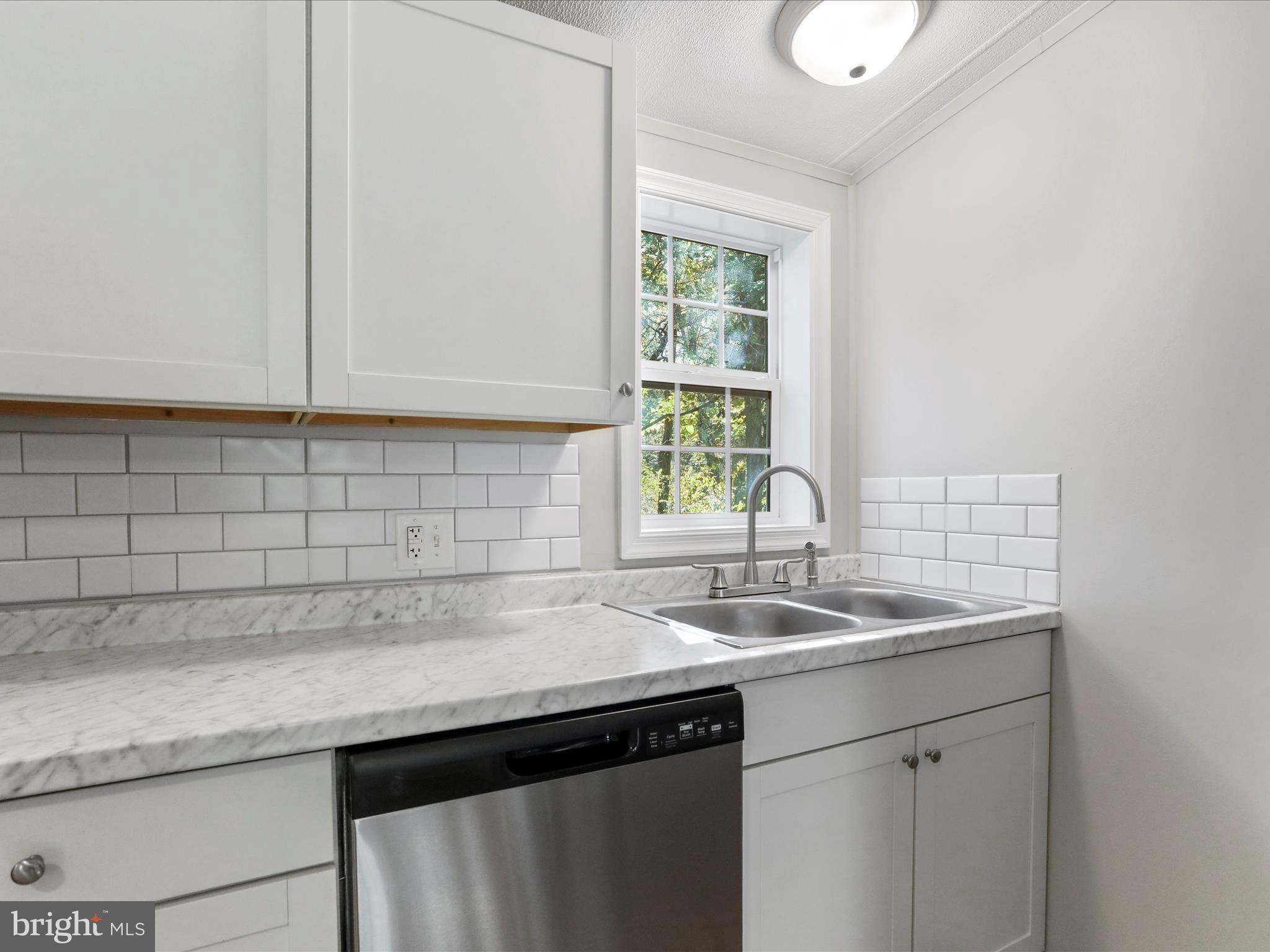 156 Potomacview Lane Berkeley Springs, WV 25411 - Photo 12 of 27 a view white cabinets and sink
