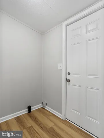 a view of a small space with wooden floor