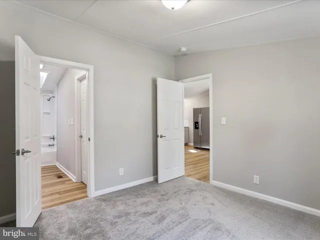 a bathroom with a sink toilet a mirror and vanity