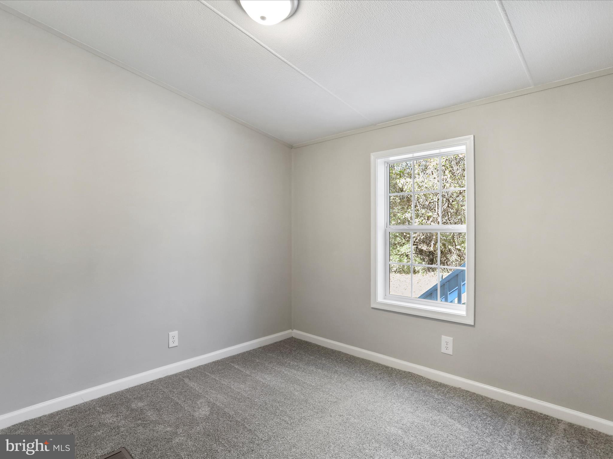 156 Potomacview Lane Berkeley Springs, WV 25411 - Photo 21 of 27 an empty room with a window