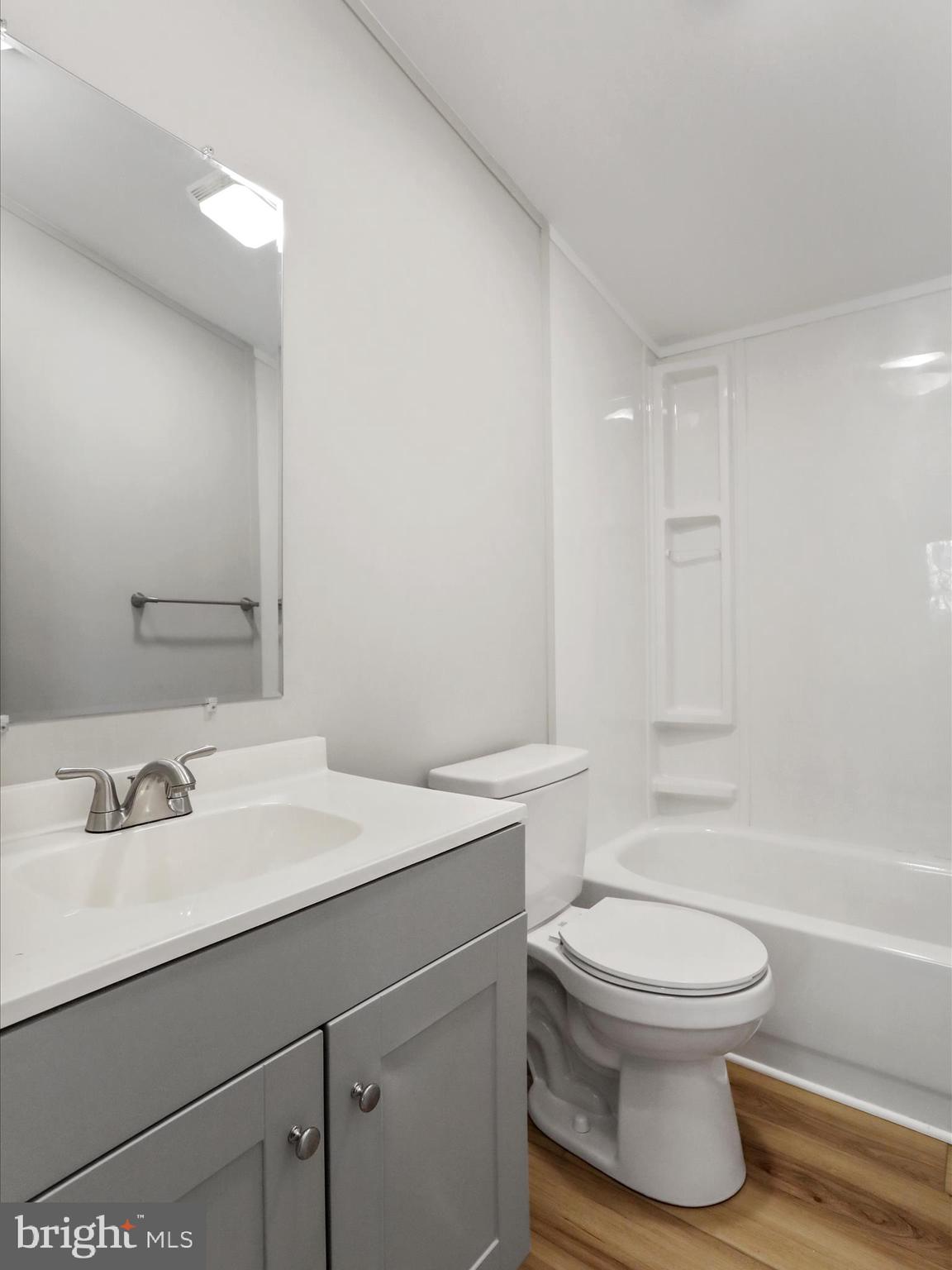 156 Potomacview Lane Berkeley Springs, WV 25411 - Photo 23 of 27 a bathroom with a sink toilet vanity and shower