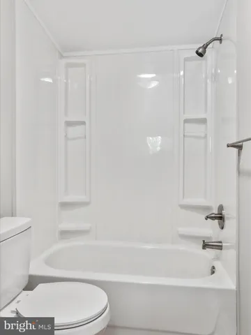 an empty room with closet area