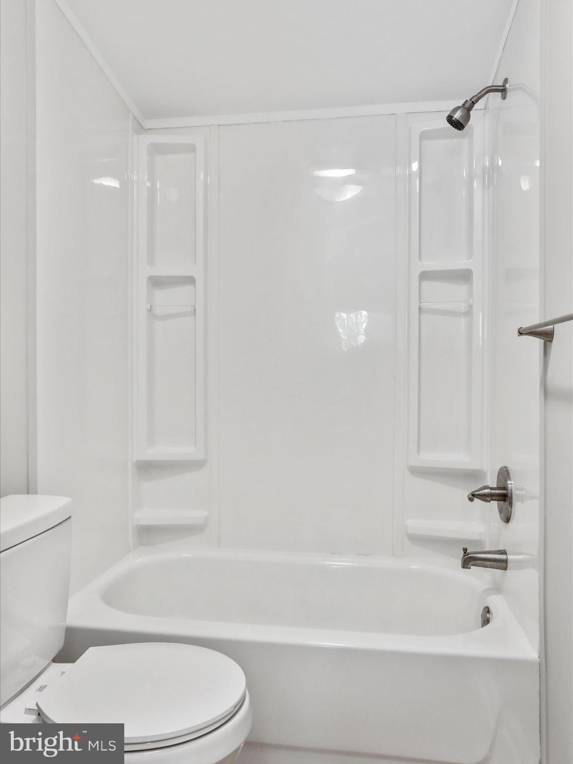 156 Potomacview Lane Berkeley Springs, WV 25411 - Photo 24 of 27 a bathroom with a toilet and a bathtub