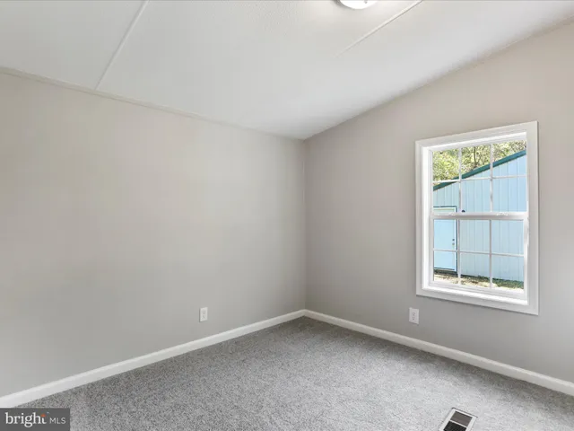 a view of a room with an empty space
