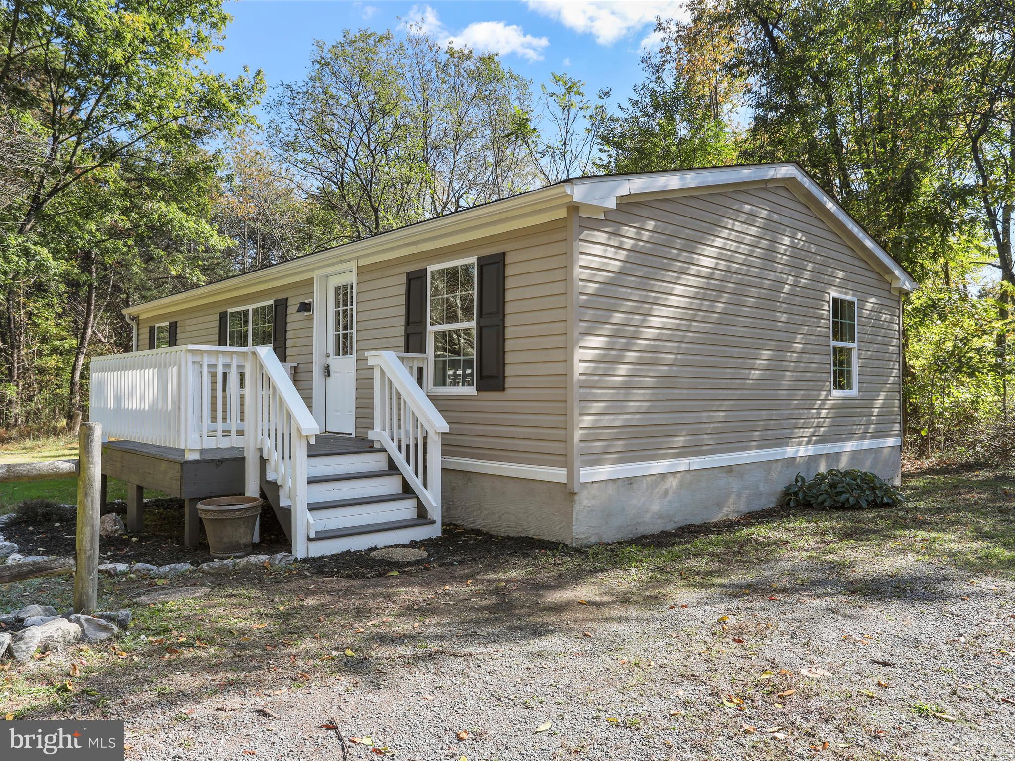 156 Potomacview Lane Berkeley Springs, WV 25411 - Photo 3 of 27 a view of a house with a yard