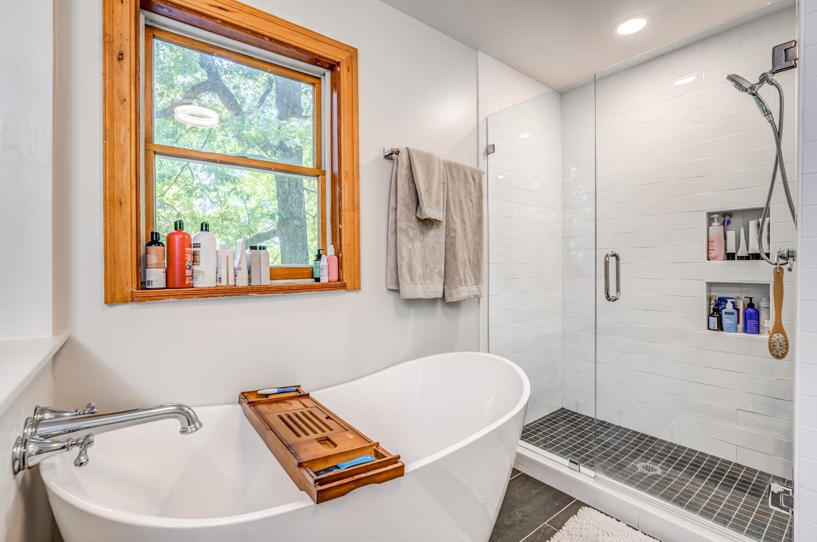 8651 Baylor Road Bartlett, TN 38002 - Photo 11 of 29 a bathroom with a bathtub and a shower