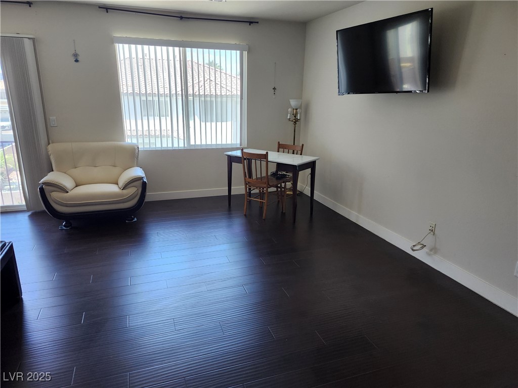 6672 Coronado Palms Avenue Las Vegas, NV 89139 - Photo 14 of 39 Living area featuring plenty of natural light, dar