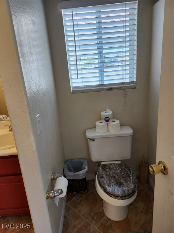 6672 Coronado Palms Avenue Las Vegas, NV 89139 - Photo 19 of 39 Bathroom with toilet, tile patterned floors, vanit