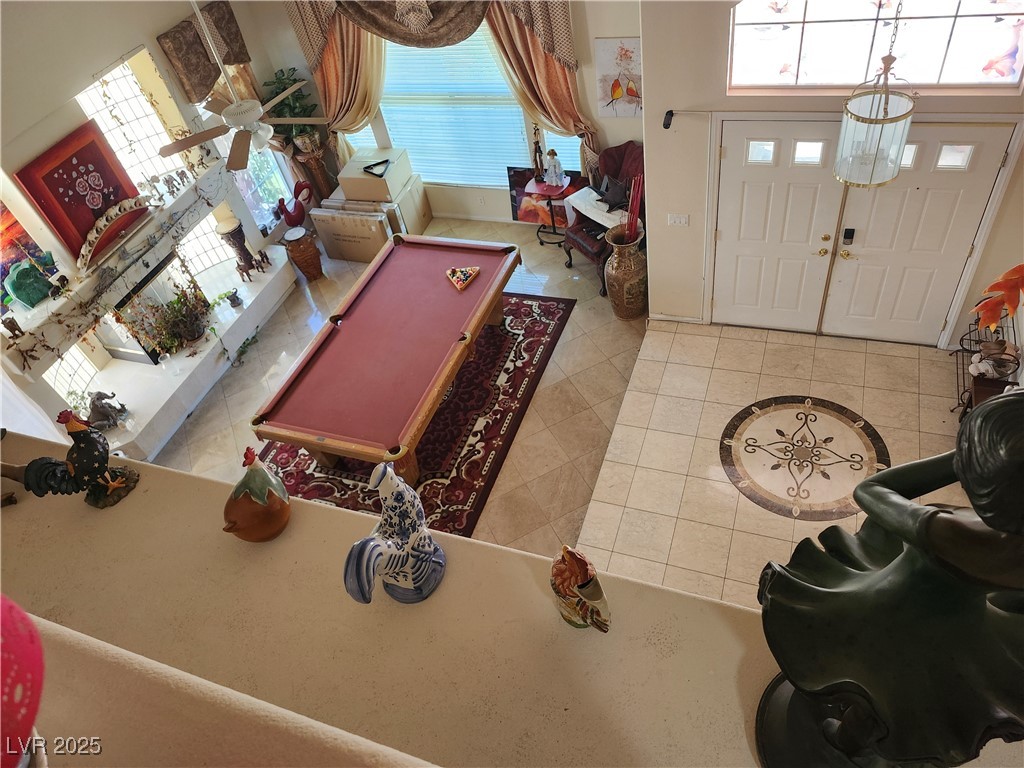 6672 Coronado Palms Avenue Las Vegas, NV 89139 - Photo 34 of 39 Living room with tile patterned floors and healthy