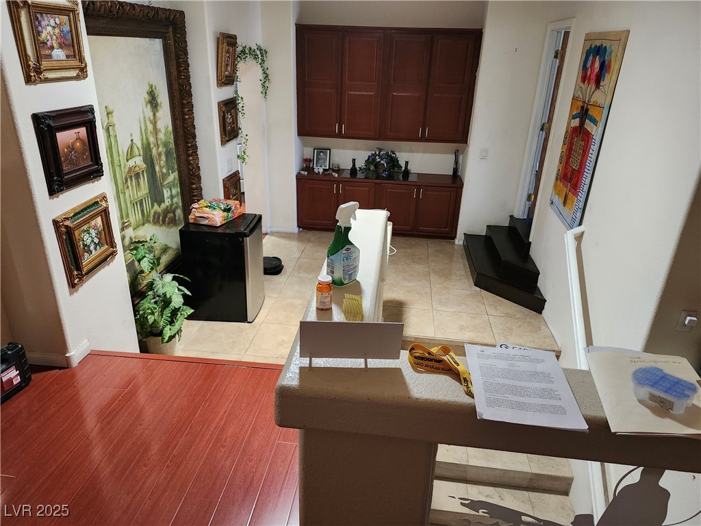 6672 Coronado Palms Avenue Las Vegas, NV 89139 - Photo 37 of 39 Living room featuring baseboards and light tile pa