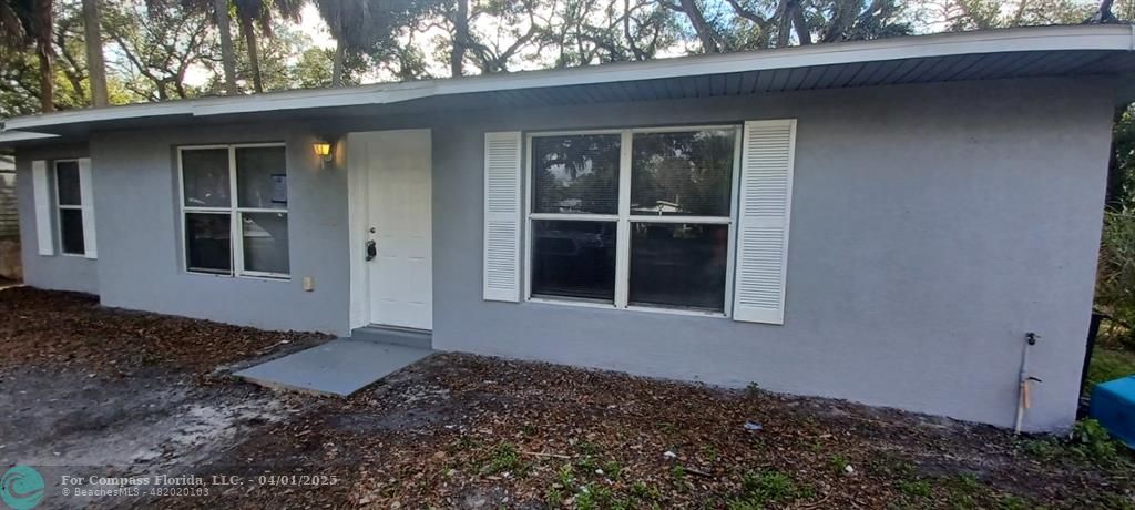 1410 Southeast 7th Street Okeechobee, FL 34974 - Photo 1 of 22 a backyard of a house