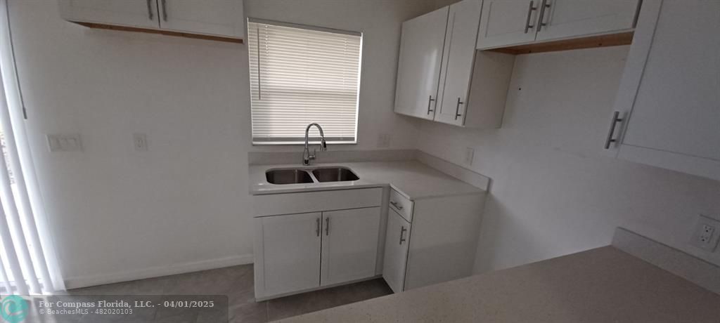 1410 Southeast 7th Street Okeechobee, FL 34974 - Photo 17 of 22 a bathroom with a sink and a window