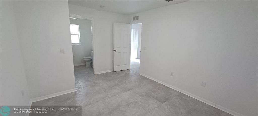 1410 Southeast 7th Street Okeechobee, FL 34974 - Photo 19 of 22 a view of an empty room and a bathroom