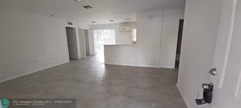 1410 Southeast 7th Street Okeechobee, FL 34974 - Photo 21 of 22 a view of a big room with closet and windows