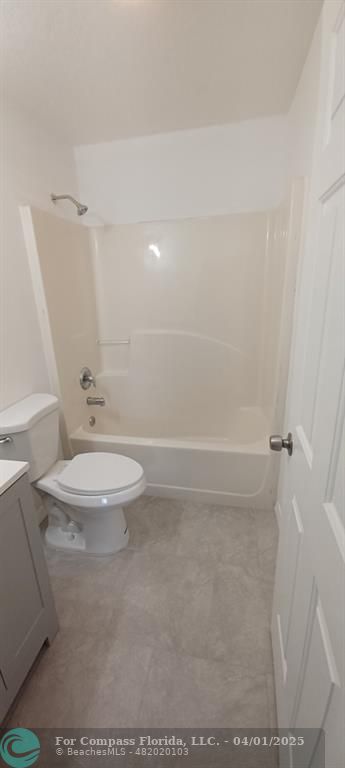 1410 Southeast 7th Street Okeechobee, FL 34974 - Photo 9 of 22 a bathroom with a toilet and a shower