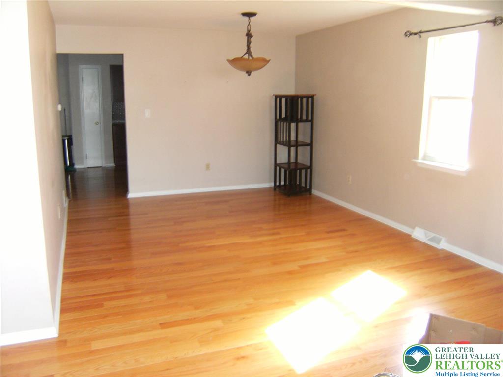 174 Springhouse Road Allentown, PA 18104 - Photo 3 of 10 a view of an empty room with a window