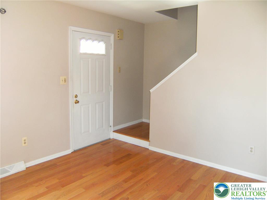 174 Springhouse Road Allentown, PA 18104 - Photo 4 of 10 a view of empty room with wooden floor