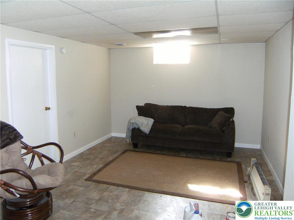 174 Springhouse Road Allentown, PA 18104 - Photo 8 of 10 a living room with a couch