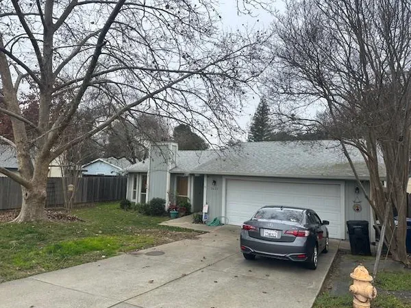 a car parked in front of a house