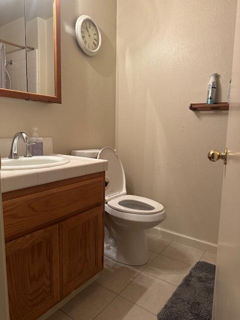 3431 Hunter Lane Carmichael, CA 95608 - Photo 4 of 6 a bathroom with a toilet a sink and a mirror