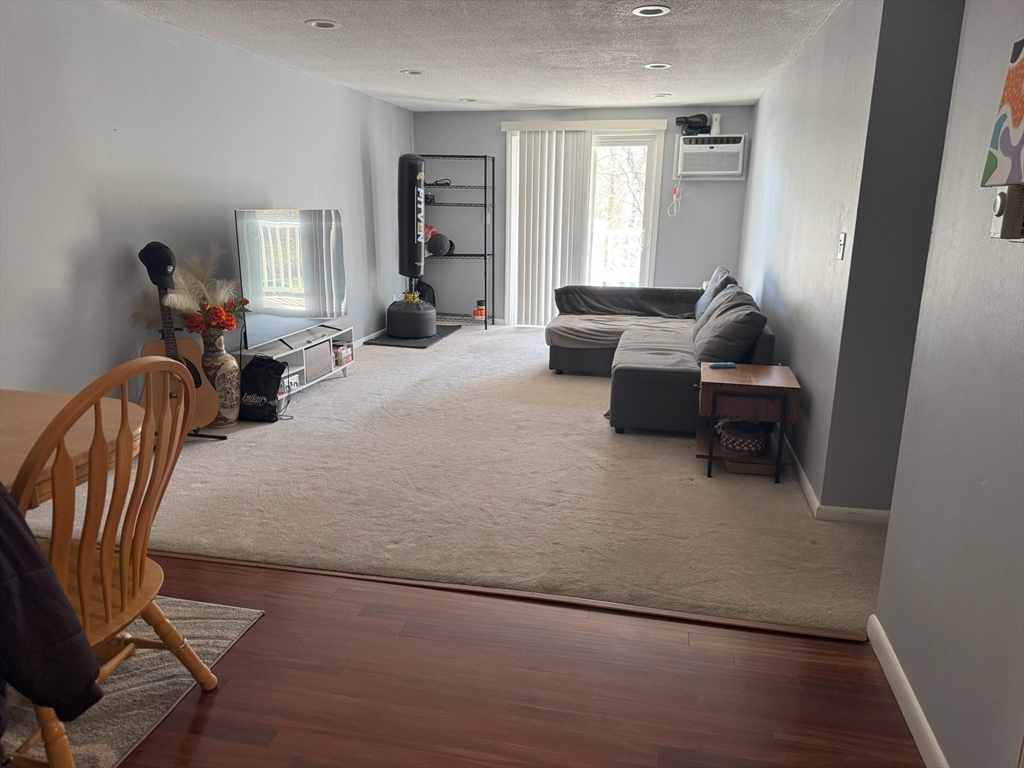 200 Manning Street, Unit 14B Hudson, MA 01749 - Photo 5 of 9 a living room with furniture and a window