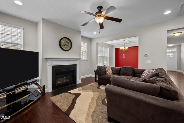 a living room with furniture and kitchen view